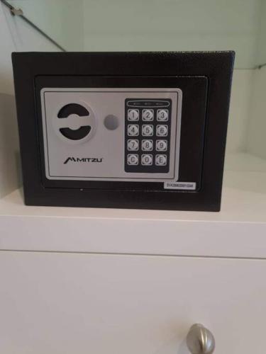 a remote control sitting on top of a dresser at Insurgentes Area APT Balcony, Outdoor Lounge in Mexico City