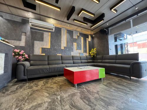 a lobby with a couch and a coffee table at C2 Hotel in Mathura