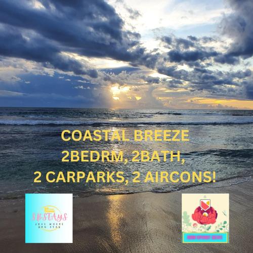 a beach with two signs on the sand and the ocean at Coastal Breeze 2Bedrm 2Bath Pool & Slide in Perth