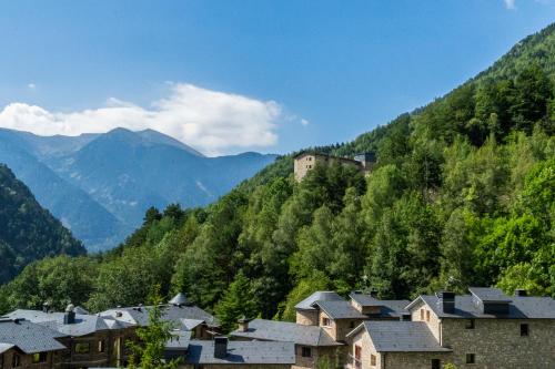 a village in a valley with mountains in the background at Abba Xalet Suites Hotel in Sispony