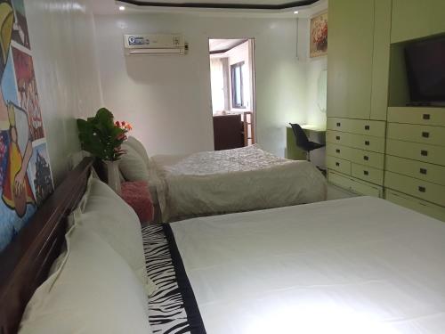 Katil atau katil-katil dalam bilik di Huge room with kitchen