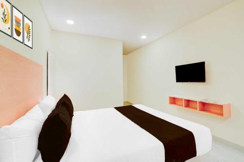 Katil atau katil-katil dalam bilik di Hotel O JP Nagar Miyapur