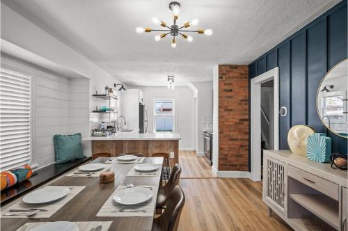 a dining room and kitchen with a table and chairs at Amazing Parma Home King Bed Full Office Room in Parma