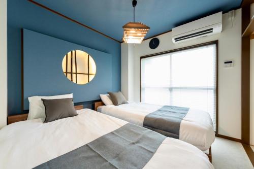 Postel nebo postele na pokoji v ubytování 2名推奨駒込駅Switch付き施設