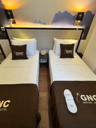 Katil atau katil-katil dalam bilik di Gnc Airport Hotel