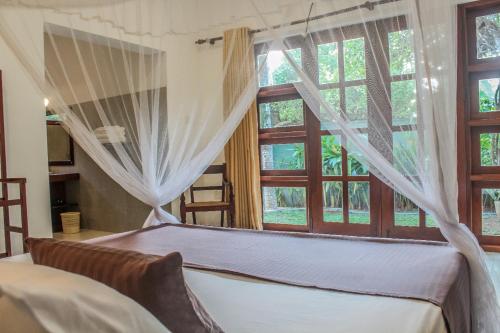 Ένα ή περισσότερα κρεβάτια σε δωμάτιο στο Thisara Villa