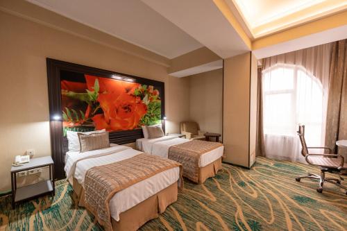 Katil atau katil-katil dalam bilik di Hotel Kazzhol Almaty