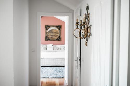 a bedroom with a bed and a mirror at My Wonderland in Salzburg