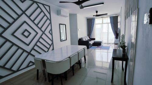 a living room with a table and a couch at Sadiyra Homestay sebelah Alamanda Mall dan Tasik Putrajaya in Putrajaya