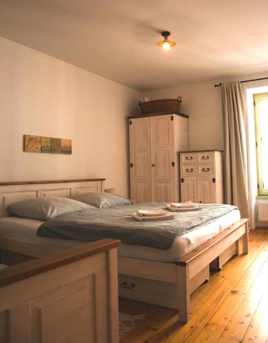 a bedroom with a large bed in a room at Apartmán č.2 in Banská Štiavnica
