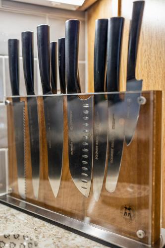a row of knives in a knife block on a counter at Polar Express Hot Tub Pool Table Mountain Views in Williams