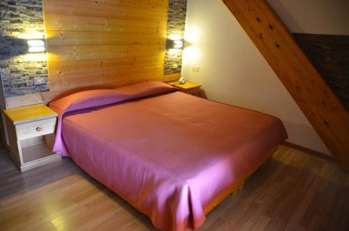 Postel nebo postele na pokoji v ubytování Hotel Corona