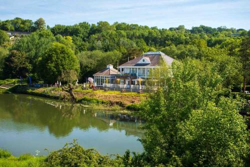 a house on the bank of a river at The Boathouse in Bath