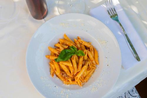 a plate of french fries on a table at Aura Living Hotel in Rimini