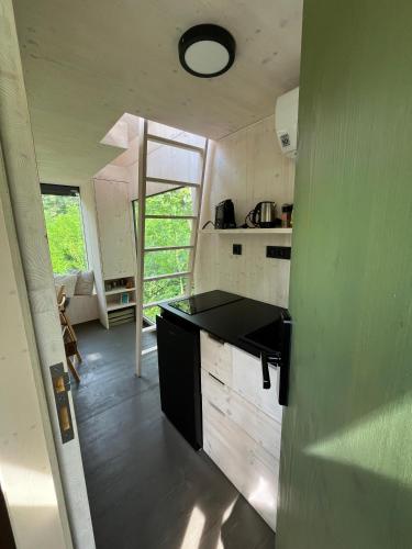 a kitchen with a black counter top in a room at Posed U HRADU in Jaklovec