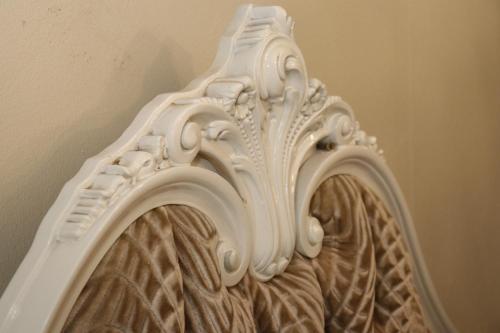 a white vase sitting next to a wall at Victoria Manor in Upington