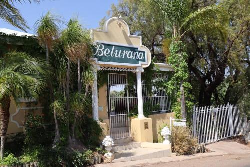 a building with a sign for a hotel at Victoria Manor in Upington
