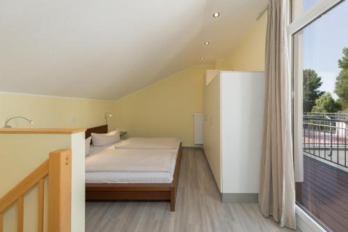 Un pat sau paturi într-o cameră la Schneeeule 207