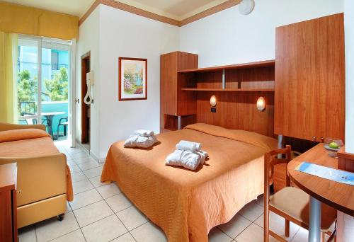 En eller flere senger på et rom på Park Hotel Morigi Garden & Spa