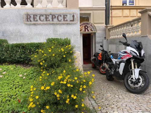 two motorcycles parked in front of a building at Hotel Rudolf II Karlovy Vary in Karlovy Vary