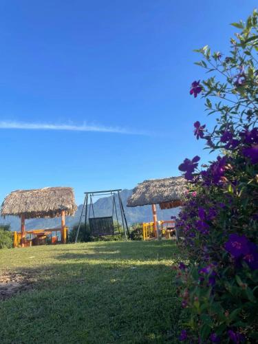 a park with a swing and a playground at Homestay Chân Mây Chiêu Lầu Thi in Hoàng Su Phì