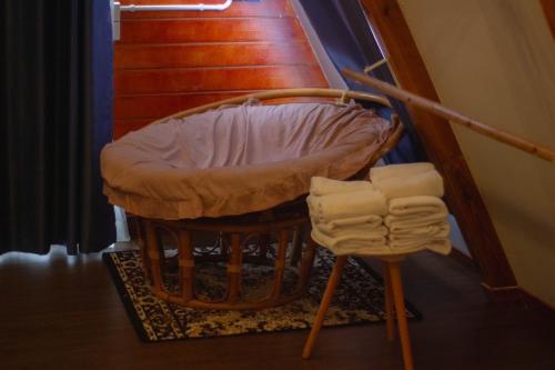 a stool sitting next to a set of stairs at นานาเพชรบูรณ์ รีสอร์ท&คาเฟ่ 
