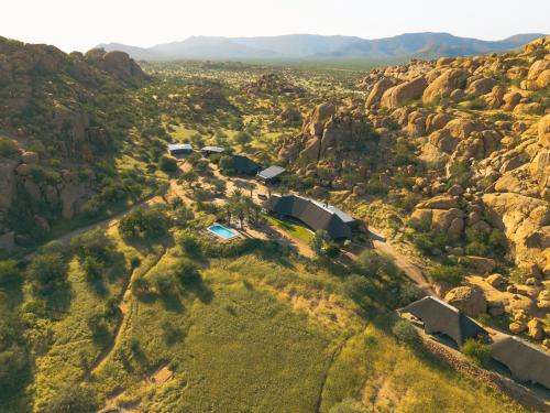 an aerial view of a house on a mountain at Ai Aiba - The Rock Painting Lodge in Omaruru