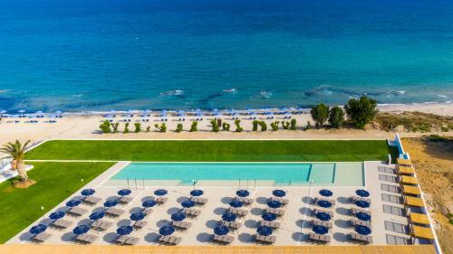 an aerial view of a resort with a swimming pool and the ocean at Smy Kos Beach & Splash in Mastichari