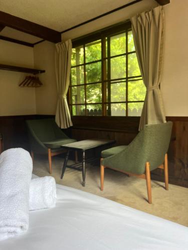 Ένα ή περισσότερα κρεβάτια σε δωμάτιο στο Twin Peaks Lodge