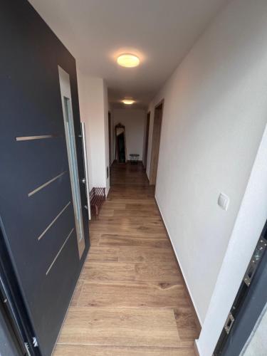 a hallway with a long corridor with wooden floors at Busu in Sulzbach-Rosenberg