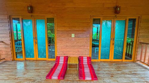 a red rug sitting in the middle of a building at Nha-Da Land New Area in Chiang Dao
