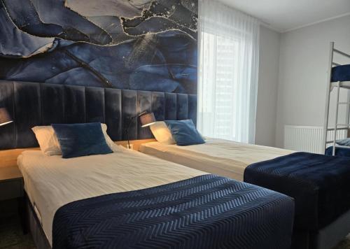 Postel nebo postele na pokoji v ubytování Hotton Hotel