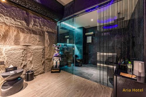 a bathroom with a shower with a toilet in it at Oria Hotel Gò Vấp in Ho Chi Minh City