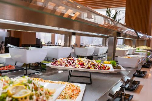 a buffet line with many different types of food at Smy Kos Beach & Splash in Mastichari