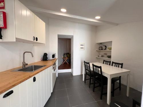 Η κουζίνα ή μικρή κουζίνα στο GuestReady - Enchanting retreat in Alcácer do Sal