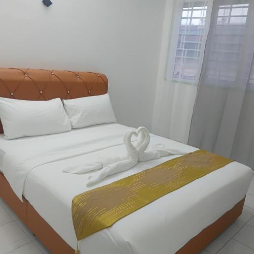 Una cama o camas en una habitación de Olive home