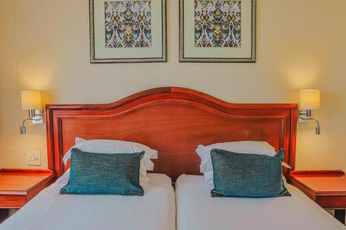 Ένα ή περισσότερα κρεβάτια σε δωμάτιο στο Premier Hotel Regent