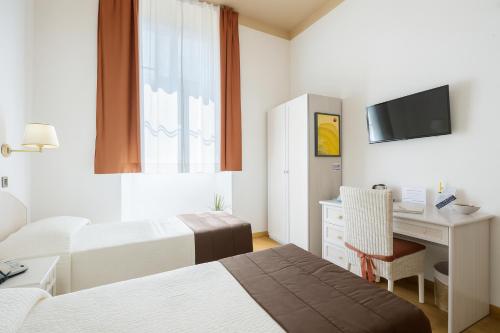 Ένα ή περισσότερα κρεβάτια σε δωμάτιο στο Piazza Paradiso Accommodation