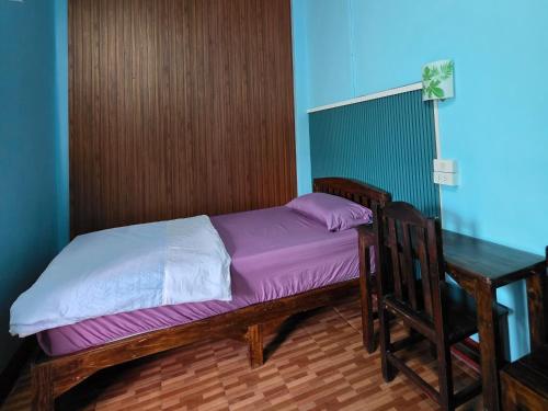 Postel nebo postele na pokoji v ubytování JaiSabai Homestay
