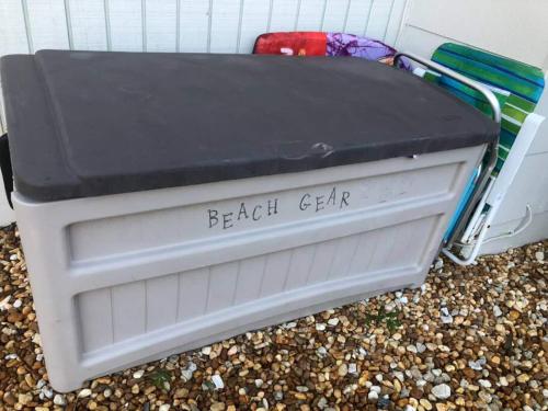 a beach chair sitting on the ground next to a building at Great Shape After Milton-pool Home Wows! Po in Venice