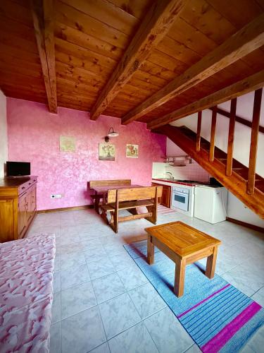 a kitchen with wooden tables in a room at Agriturismo Corte Sakura in Montefiascone