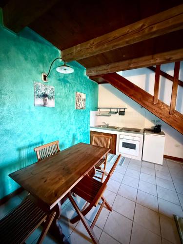 a kitchen with a wooden table in a room at Agriturismo Corte Sakura in Montefiascone