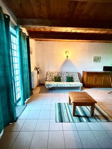 a living room with a couch and a coffee table at Agriturismo Corte Sakura in Montefiascone
