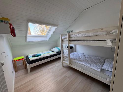 Postel nebo postele na pokoji v ubytování Sand & Siel Dangast