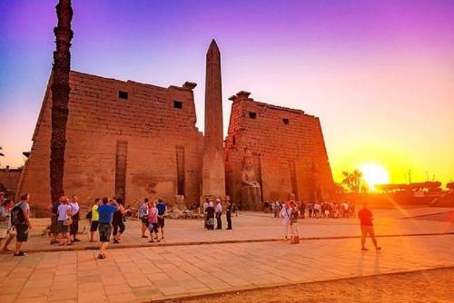 a group of people standing in front of a building at Bastet Retreat Hotel in Luxor