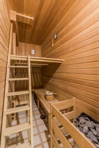 a sauna with a bunk bed and a ladder at Hisa Taljat in Most na Soči