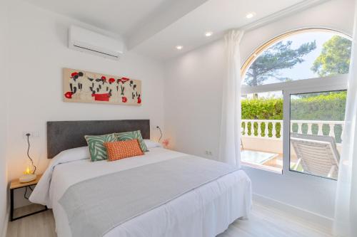 Una cama o camas en una habitación de Coral SeaShell by Fidalsa