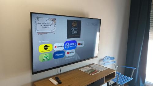 a flat screen tv sitting on a wall at Hostel Elios in Lorca
