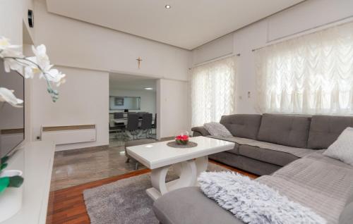 a living room with a couch and a table at Villa Ante - Makarska by Villas Guide in Gornja Glavina