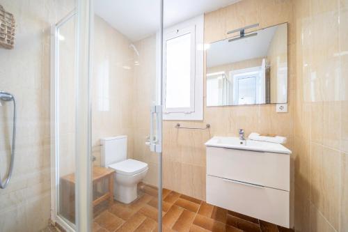 a bathroom with a toilet and a sink and a shower at HomeHolidaysRentals Arlene in Calella